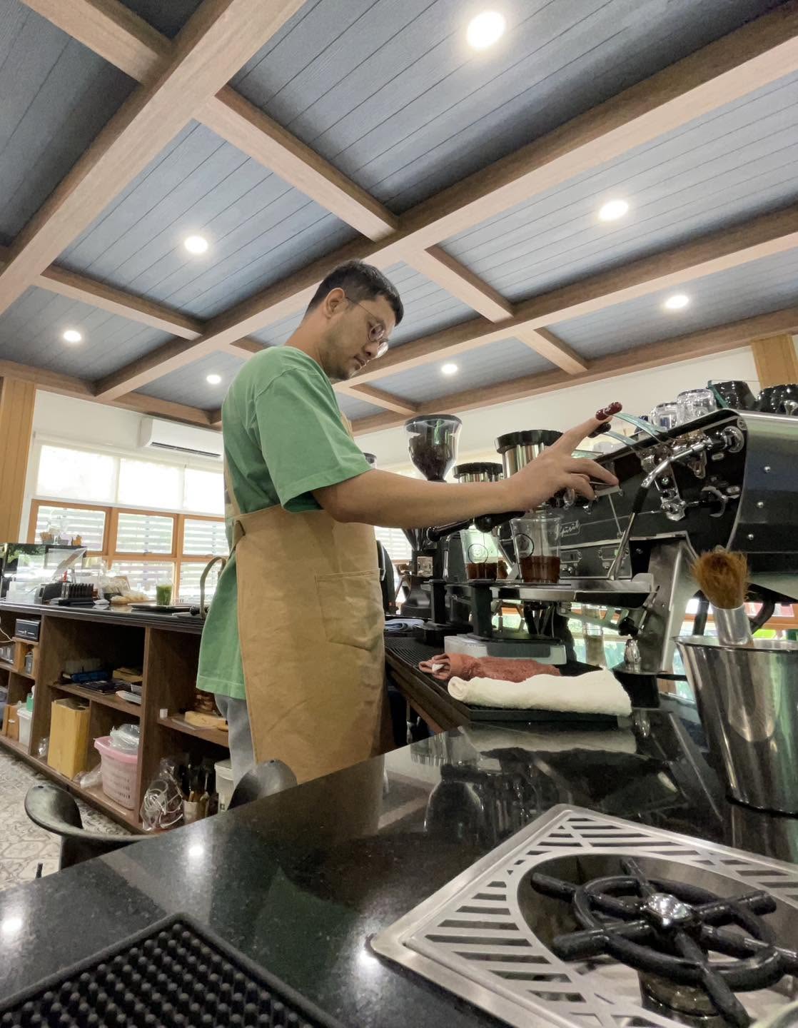 Thanapatra preparing espresso at Tibbetts Coffee House